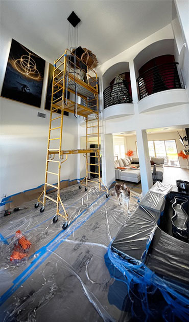 San Marcos Drywall Repair team repairing drywall on a ceiling on high scaffolding